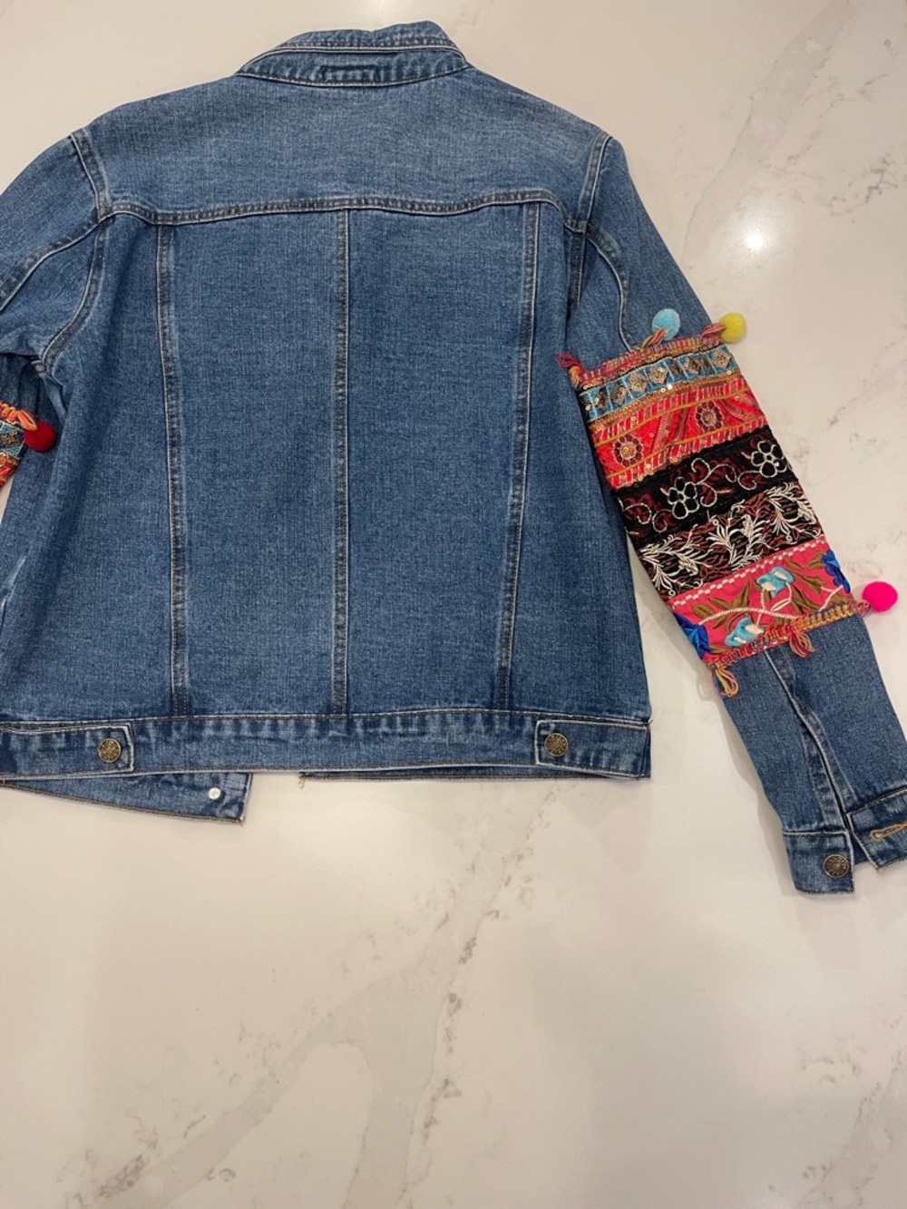 Velzera Women’s Denim Jacket with Multicolor Embroidered Panels and Pom-Poms - Picture 15 of 16